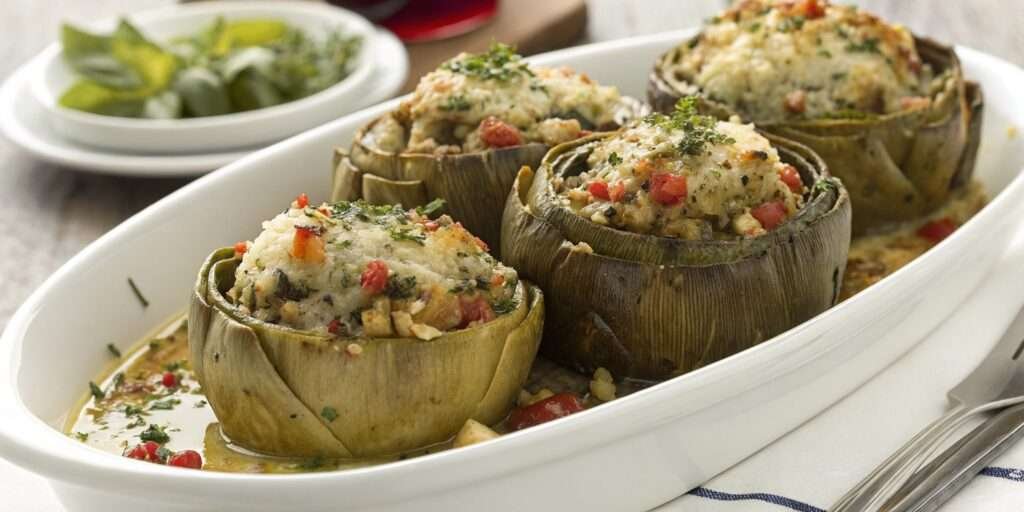 Platter of stuffed artichokes, fresh out of the oven, ready to serve